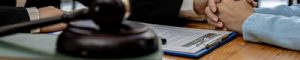 Lawyers shake hands to encourage clients who come to join the ca Lawyers shake hands to encourage clients who come to join the case of embezzlement from business partners who invest in doing business. The concept of hiring a lawyer for legal proceedings.